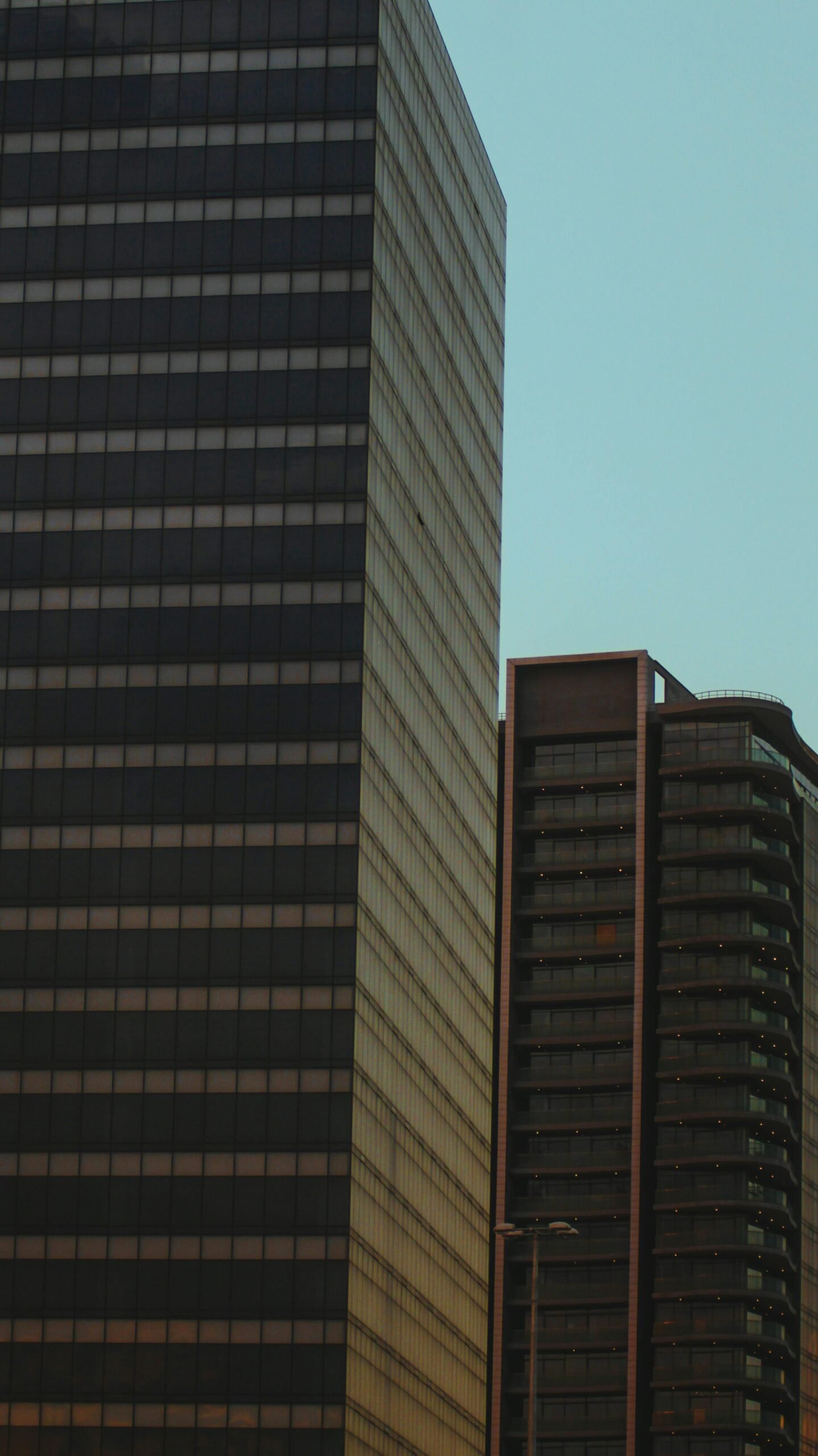 Tall modern skyscrapers in Abuja, Nigeria showcase urban architecture.